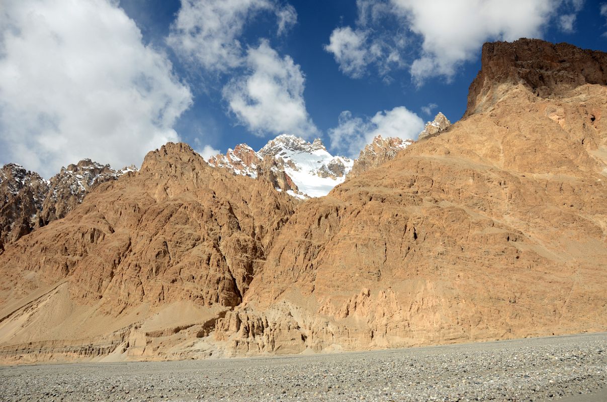 09 Eroded Hills And Snow Covered Mountain On Side Of Shaksgam Valley On Trek To Gasherbrum North Base Camp In China 